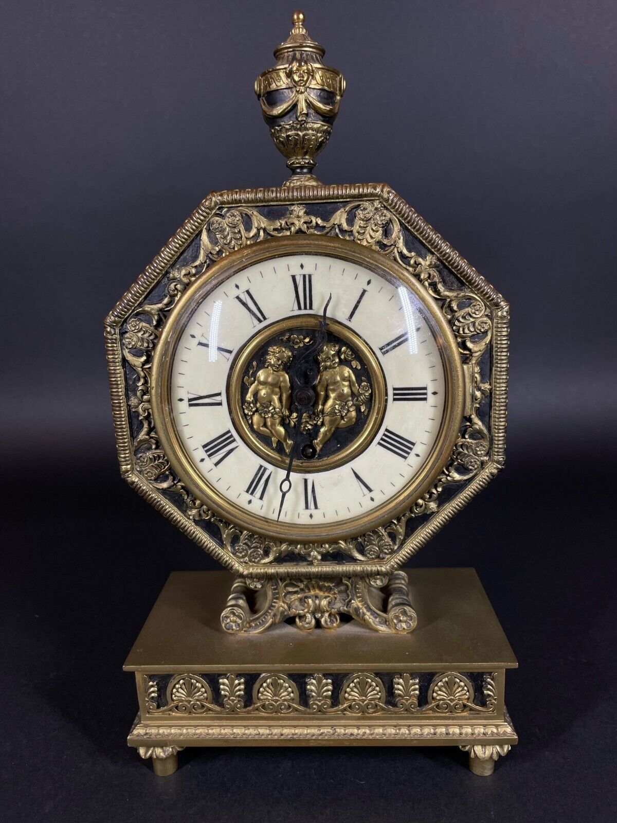 Antique Edward F Caldwell Bronze Octagonal Mantel Clock w Cherubs & Urn Finial