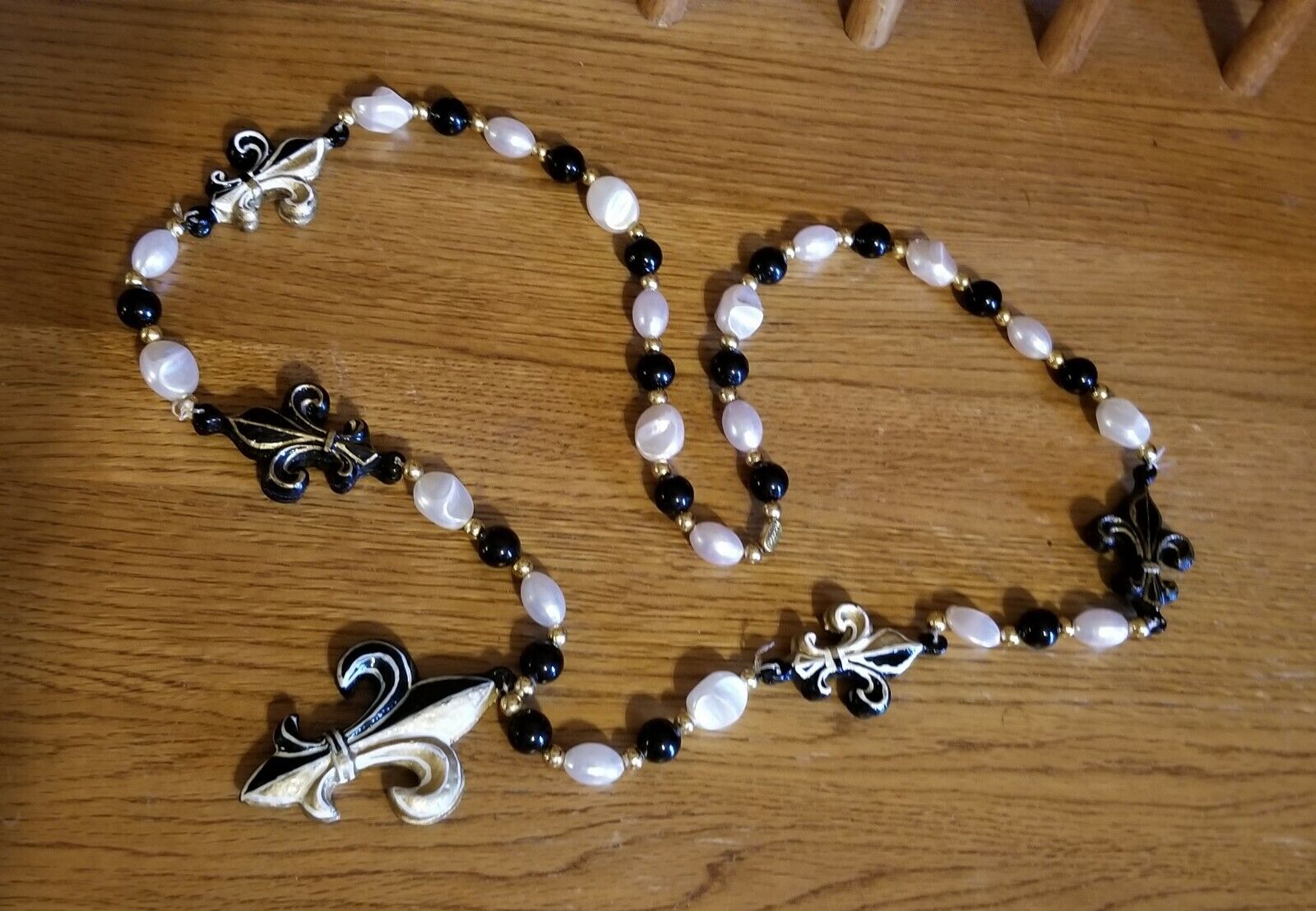 Vintage Mardi Gras bead necklace. Black & gold fleur de lis saints color. Large 