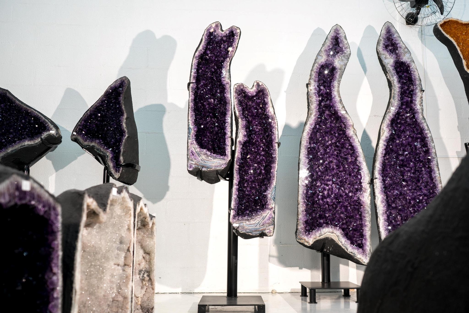 Sculptural Pair of Amethyst Geodes Set on Custom Stands, 6.6 Ft. Tall, AAA-Grade Sculptural Pair of Amethyst Geodes Set on Custom Stands, 6.6 Ft. Tall, AAA-Grade