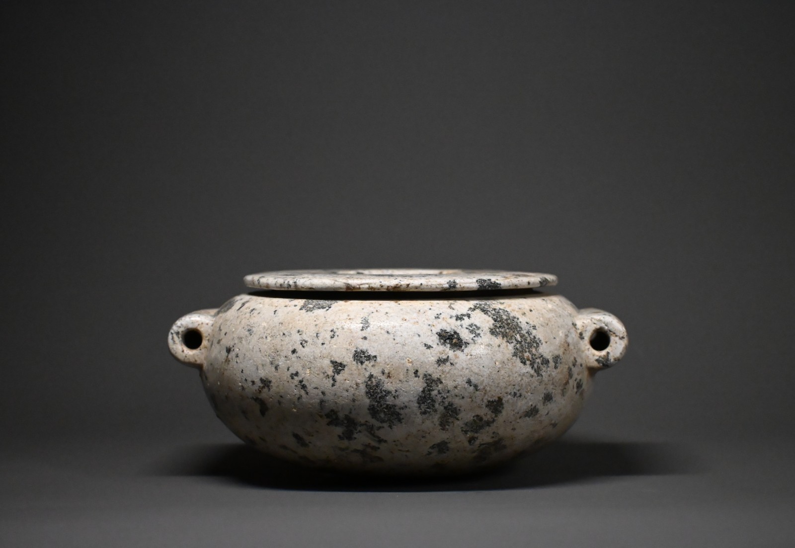 CIRCA AN EGYPTIAN DIORITE STONE JAR. CIRCA AN EGYPTIAN DIORITE STONE JAR.