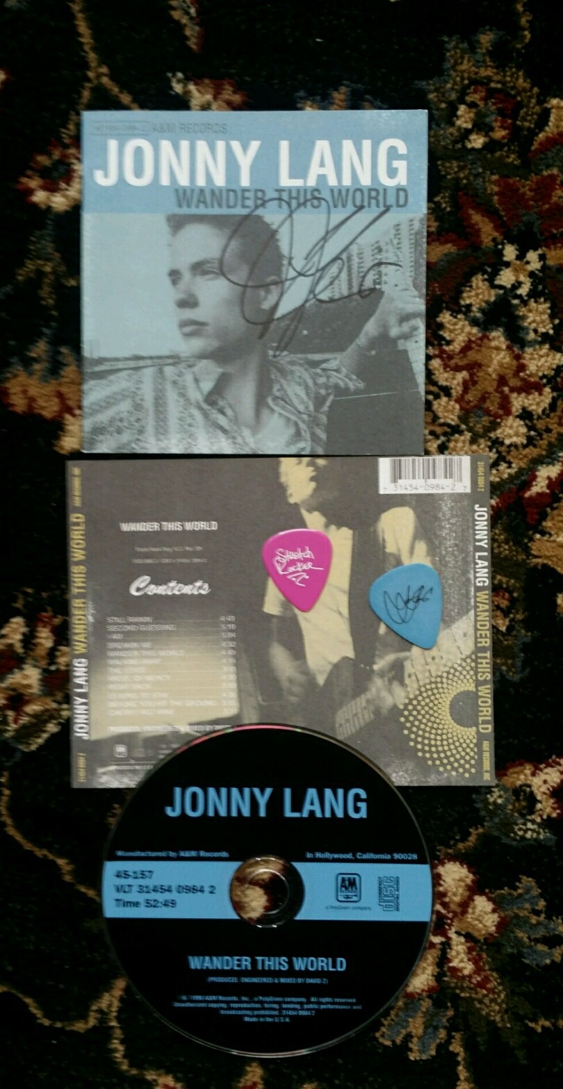 JONNY LANG AUTOGRAPHED SIGNED WANDER THIS WORLD CD w/ GUITAR PICKS 2 PICK SET JONNY LANG AUTOGRAPHED SIGNED WANDER THIS WORLD CD w/ GUITAR PICKS 2 PICK SET