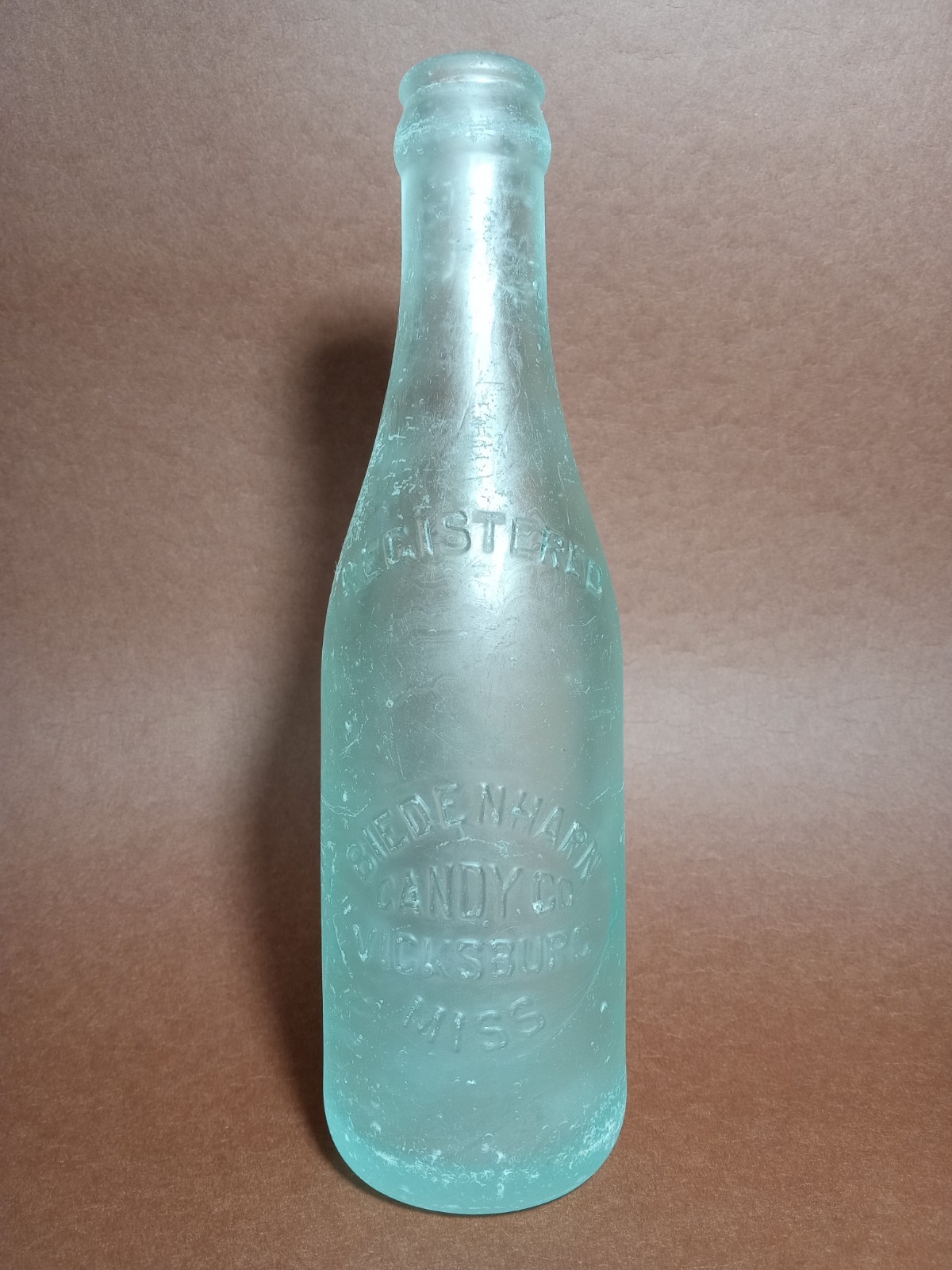 1st Coca-Cola Bottle 1899 Biedenharn Candy Co. Straight Side Crown-Top SB&GCo. 1st Coca-Cola Bottle 1899 Biedenharn Candy Co. Straight Side Crown-Top SB&GCo.