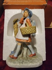 Collection of vintage Hummels and Norman Rockwell figurines picture