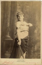 Isabelle Urquhart actress singer with dagger antique cabinet photo picture