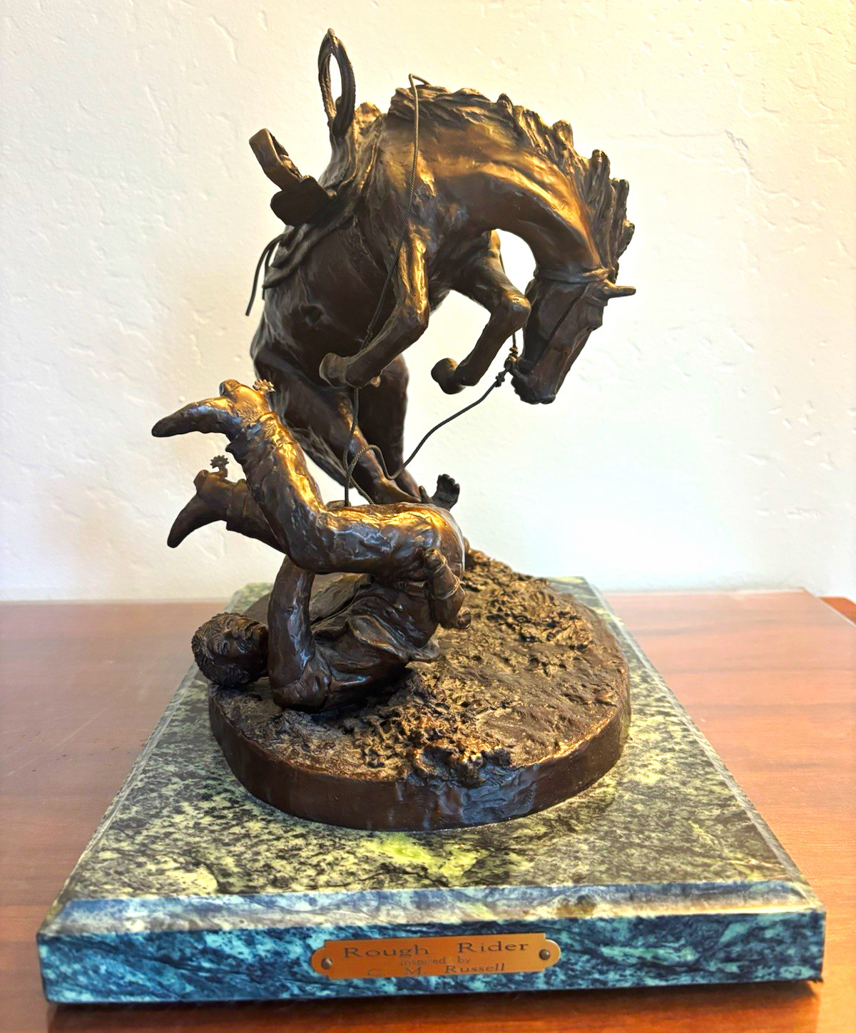 C. M. Russell inspired Bronze Cowboy Sculpture on Marble Base “Rough Rider” C. M. Russell inspired Bronze Cowboy Sculpture on Marble Base “Rough Rider”