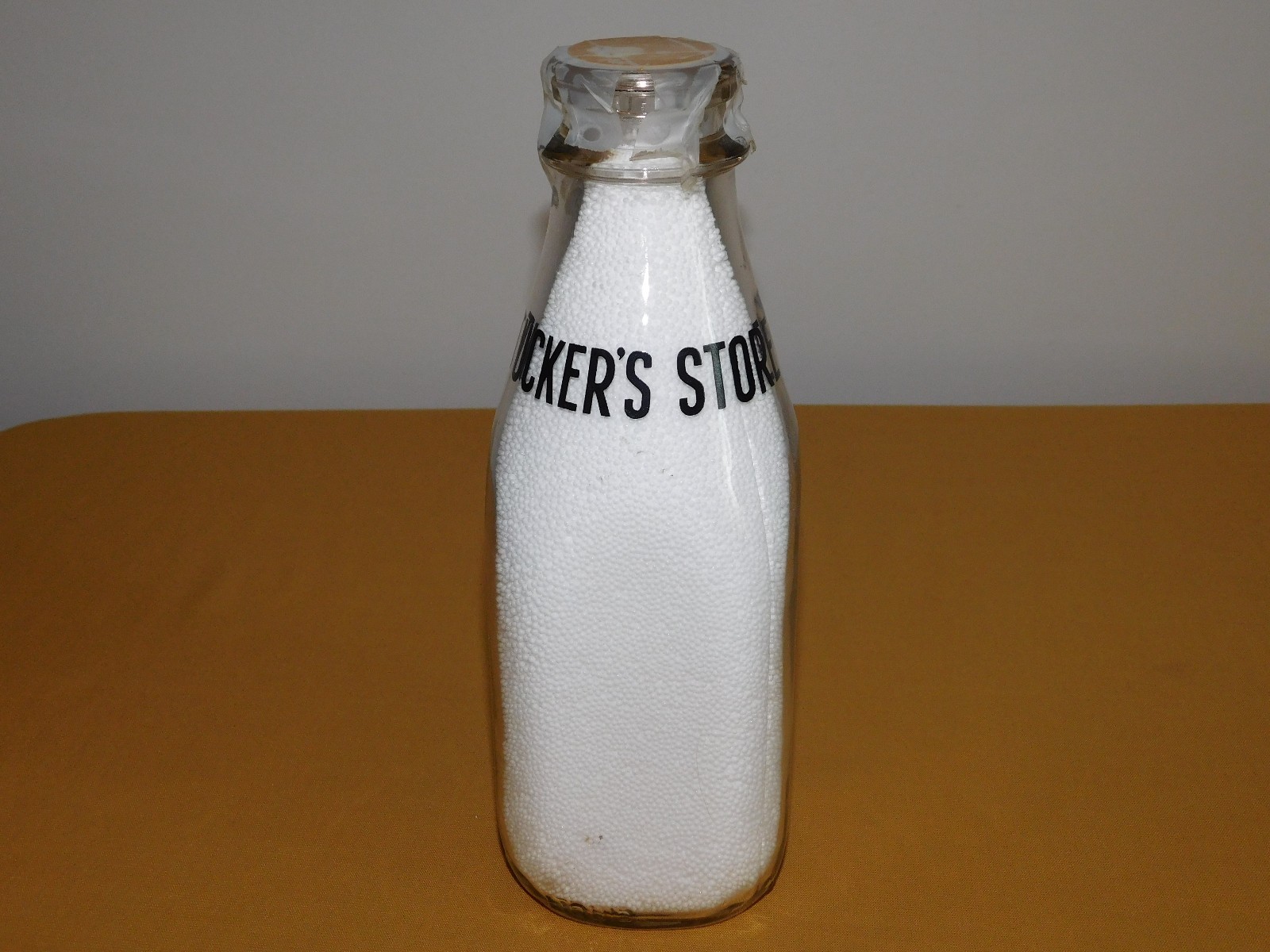 VINTAGE OLD 1956 TUCKER'S STORE 1 ONE QUART MILK BOTTLE VINTAGE OLD 1956 TUCKER'S STORE 1 ONE QUART MILK BOTTLE