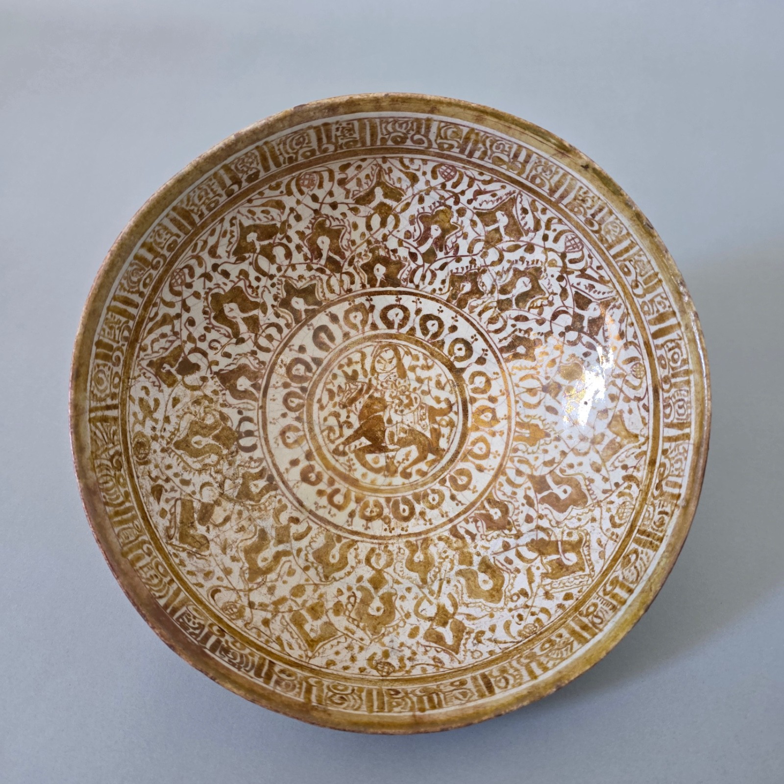 Islamic Lustreware Bowl with Calligraphic Border & Figural Decoration Islamic Lustreware Bowl with Calligraphic Border & Figural Decoration